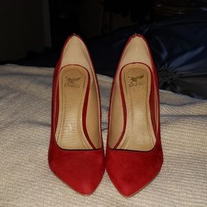 Red pointed toe pumps